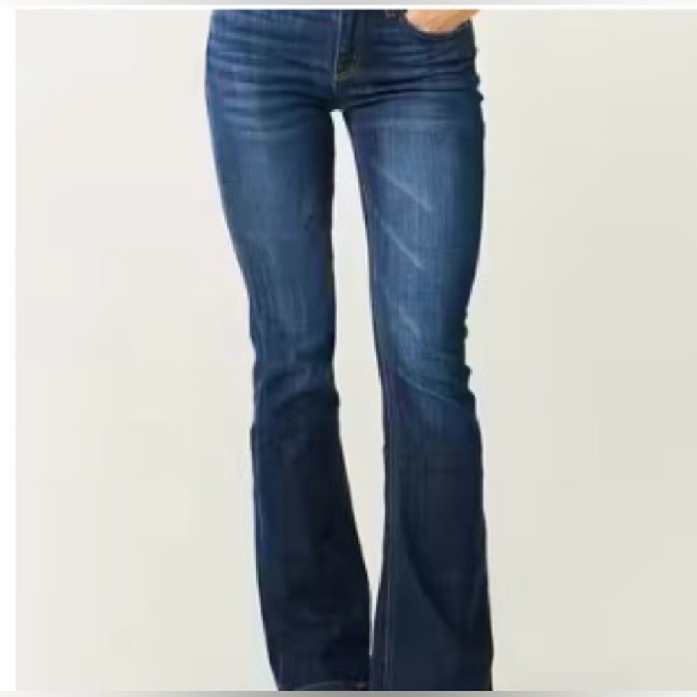 Women's dark rinse distressed flare leg stretch jeans